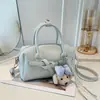 Nova Bolsa de Mão Texturizada de Nicho Estilo Francês para Mulheres, Bolsa Transversal com Acabamento de Luxo, Bolsa Almofada com Fecho Padrão Lichia para a Primavera de 2026