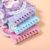 Nueva cubierta láser Sanrio tres en uno con forma de libro de espiral colgante infantil material para cuenta manual DIY libro de pegatinas