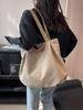 Bolsa Feminina Estilo Casual de Nicho de Luxo Verão 2026 Nova Versão Coreana Bolsa de Lona Tote de Grande Capacidade Bolsa de Ombro para o Dia a Dia