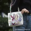 Bolso nuevo de estilo étnico, con tela color arena y bordado, un diseño fresco y casual, con bordado de hilo dorado a doble cara, una bolsa pequeña de tela y una bolsa estilo Hanfu