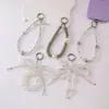Cadena para teléfono de cristal con lazo incrustado de diamantes de alta gama, minimalista y lujosa, con un diseño fresco y delicado, que sirve como correa para teléfono, accesorio para la muñeca o adorno colgante