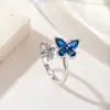 Anillo Doble Mariposa Super Brillante de Circonita de Color y Circonia Cúbica de Cobre Transfronterizo Europeo y Americano Joyería de Nicho para Viajeros Suministro Directo de Fábrica de Joyería Yiwu