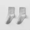 Calcetines de niño verano calcetines finos de algodón calcetines blancos para niño calcetines de malla para niña calcetines deportivos de tubo con pupilas negras