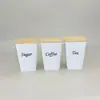 Tapa de café de bambú en forma de T tapa de té caramelo lata de embalaje metálico caja de hojalata estilo europeo y americano tapa de bambú almacenamiento de cocina juego de tres piezas