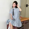 Vestido de Verano para Niñas 2026 Nuevo Elegante Estilo Universitario Vestido Camisa a Cuadros con Cuello Polo para Niños Mayores Moderno