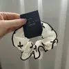 Anel de Cabelo Listrado de Cabeça de Bola Intestino Grosso Celebrante da Internet 2025 Novo Estilo Corda de Cabelo para Rabo de Cavalo Alto Acessório de Cabelo Feminino Corda de Cabelo