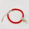 Este año pulsera de cordón rojo cobre rojo calabaza festiva bolsa de dinero oro rosa femenina acero de titanio retención de color regalo de Tanabata