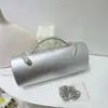 Nuevo bolso de noche de lujo ligero transfronterizo para mujer, bolso de mano cilíndrico de color liso con asa de serpiente para fiestas de cóctel y banquetes