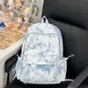 Mochila tie-dye nueva de estilo INS 2026 para niñas, versión coreana, ligera, adecuada para estudiantes de secundaria, mochila de gran capacidad