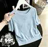 Moda Francesa de Verão 2026 Gola Redonda com Contas Manga Bufante Feminina Malha Jacquard Fina Manga Meia