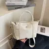 Bolso Pequeño Cuadrado Ligero de Nicho Casual 2025 Nuevo Versátil Casual Retro Color Puro Tela de Nylon Bolso de Hombro Cruzado