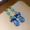 Aretes de aguja plateada con lentejuela redonda de cristal tachonada de diamantes en forma de lágrima, un toque de lujo y sofisticación, con diseños de borlas, aretes de moda y elegantes para mujer