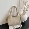 Nueva bolsa de hombro transfronteriza con diseño tejido en relieve, bolso de mano de gran capacidad, bolsa cruzada versátil para el día a día, bolso para mujer personalizado OEM