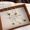 Cadena de suéter larga de ojo de tigre de nuevo estilo para Otoño e Invierno, Elegantes y a la moda Accesorios de Decoración para Fotos de Otoño e Invierno