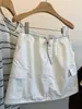 Falda blanca de estilo coreano con bolsillos de trabajo para mujer, falda corta de verano con cordón y cintura elástica, línea A, anti-exposición, nuevo modelo 2026