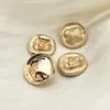 Suministro directo metal cóncavo-convexo superficie corrugada redondo irregular botón metálico abrigo traje tweed moda hebilla decorativa