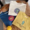 Otoño 2026 Huzhou Zhili Ropa Infantil Estilo Coreano Camiseta Básica de Manga Larga para Niños y Niñas Primavera y Otoño Camiseta Beige