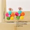 Moda europea y americana Aretes coreanos de rafia tejida a mano Aretes bohemios de flores a juego de colores Aretes de flores de cinco pétalos al por mayor
