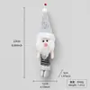 Colgantes de muñecos de Navidad de patas de resorte transfronterizos, decoraciones de peluche multicolores de Papá Noel, muñeco de nieve y renos para escaparates