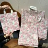 Nueva bolsa de embalaje vintage de camelia grande extra gruesa de 20 micrones para otoño e invierno, bolsa para tiendas de ropa, bolsa de plástico, bolsa de regalo