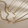 Collar para mujer estilo europeo y americano Wanxing, juego de collar con colgante de barra en T de circón de acero inoxidable chapado en oro de 18 quilates, estilo clásico, venta al por mayor transfronteriza