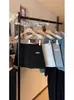Falda de Traje Negra para Mujer, Nuevo Estilo Otoño e Invierno 2025, Cintura Alta, Ceñida a la Cadera, Corte A con Pantalones Cortos de Seguridad, Elegante Falda Corta