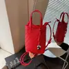 Pedido Extranjero Bolsos de Nicho para Mujer 2026 Nuevo Bolso Cubo con Patrón Tejido Bolso de Mano para Viaje Hombro Cruzado Bolso para Teléfono