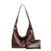 Bolsa de Verão Feminina Versátil de Grande Capacidade 2026 Nova Vintage de Ombro Único Estilo Balde com Design Texturizado para o Dia a Dia Bolsa Tote