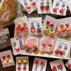 Pendientes de Clip de Resina Coloridos Lindos con Forma de Personaje de Dibujos Animados para Niñas, Accesorios de Pendientes de Lazo Corazón Explosivo