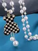 Collar de Perlas Versátil de Moda para Mujer con un Diseño de Nicho Elegante de Alta Gama, Cadena de Suéter de Lujo Ligero, Colgante Exquisito de Alto Valor