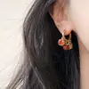 Estilo Étnico Color Rojo Contrastante Otoño e Invierno Circonita Diseño Hecho a Mano Borla de Perlas de Alta Gama Pendientes para Mujer Nuevo Estilo Caliente