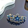 Accesorios para el cabello transfronterizos elegantes moño alto parte trasera clip superior aleación horquilla de diamantes ins flor de alta gama clip de resorte femenino