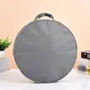 Bolsa de mano de tela Oxford al por mayor de fábrica, logo personalizado, bolsa de compras impermeable para regalo, bolsa de embalaje redonda de tela Oxford