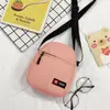 Bolsa para Celular Pequena Bolsa Masculina 2021 Nova Tendência Transversal Feminina Bolsa de Ombro Pequena Versátil para Estudante Celebridade da Internet Mini Bolsa de Lona
