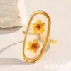 Europa y Estados Unidos venta caliente transfronteriza temperamento alto nivel nicho joyería acero inoxidable chapado en oro de 18K acrílico seco anillo abierto