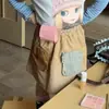 Conjunto de Duas Peças Tendência 2026 para Meninas de Início de Outono: Trench Coat Super Fofo e Estiloso com Estampa de Pinguim e Gola Dobrada e Saia Curta Casual Estilo Coreano