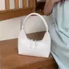 Nova Bolsa de Ombro de Prata em Formato de Meia-Lua para Primavera e Verão para Mulheres, Bolsa de Mão de Ombro Versátil da Moda Estilo Francês