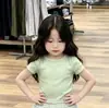 Conjunto de Duas Peças Verão 2026 Estilo Coreano Novo Top de Manga Curta Verde Pequeno Fresco com Saia Plaid Versátil