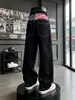 Jeans para hombre con estampado de bandera americana retro desgastada, pantalones largos de pierna ancha con múltiples botones, pantalones negros lavados de dobladillo curvo hasta el suelo