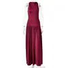 Nuevo producto de otoño estilo europeo y americano, vestido largo de color liso, simple, elegante, sexy, sin espalda, plisado, adelgazante