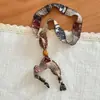 Collar con Colgante de Anillo de Flor de Anacardo Rojo Café para Mujer 2025 Otoño Nuevo Estilo Bohemio Cadena para Suéter Accesorios Versátiles