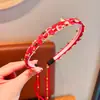 Diadema para el cabello para niños Popular en Internet 2025 Nueva Diadema roja linda de orejas de gato antideslizante para niñas de Año Nuevo