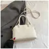 Bolso de mujer de alta gama de nicho 2026 nueva versión coreana bolso de hombro cruzado simple y elegante bolso de mano de gran capacidad moderno