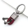 Chaveiro de carro de corda de couro trançado novo do fabricante, simples para homens, liga de zinco, padrão de pendurar na cintura, fivela de cabeça grande, cordão