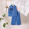 Traje de Verano Nuevo Transfronterizo 2025 para Niñas Tallas Pequeñas y Medianas Niños Diseño de Solapa Sin Mangas Chaqueta de Flores Pantalones Conjunto de Dos Piezas