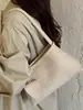 Bolsa tejida de axila de estilo francés de nicho Shuai Mi Jia para mujer, nueva bolsa elegante para el trabajo de otoño 2026, bolso de hombro vintage
