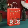 Bolsa de regalo de Santa Claus de dibujos animados para fiesta navideña infantil Bolsa tote para dulces bolsa de papel de embalaje con estampado de moda venta al por mayor