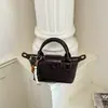 Bolsa de Tecido Nova da Moda Primavera/Verão 2026 Bolsa de Mão Estilo Bolinho de Massa Versátil de Alta Qualidade Bolsa de Ombro Transversal Tendência
