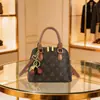 Bolsa Popular Transfronteriza Más Vendida para Mujer 2026 Nuevo Súper Caliente Monograma Cadena Bolsa tipo Concha Versátil Bolso de Hombro Único Cruzado
