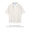 Camisa de manga corta a rayas, corte holgado, casual, marca de moda, nueva moda para hombre, camisa elegante y moderna, camisa de imitación de dos piezas